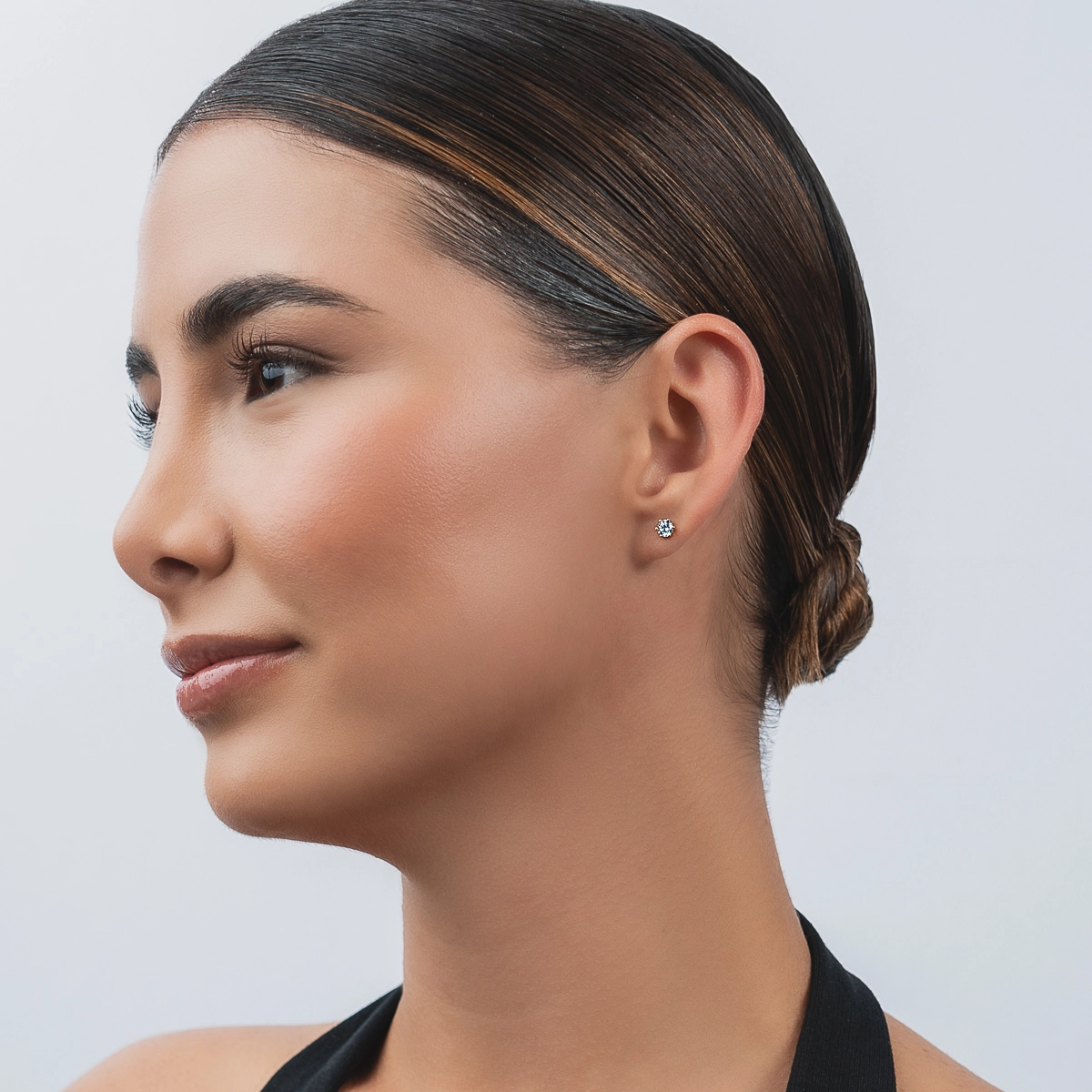 Topos studs en oro amarillo de 18 Kilates, con 2 zircones centrales