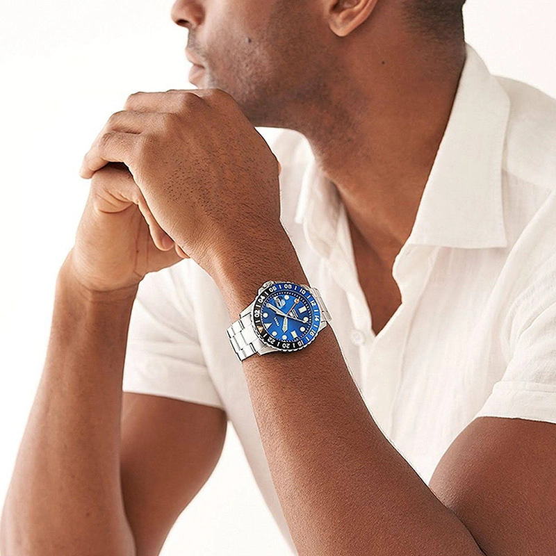 Reloj Fossil analogo, para Hombre, tablero redondo color azul, estilo index + puntos, pulso acero color plateado, calendario